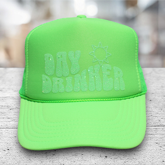 neon green trucker hat with glitter vinyl saying day drinker